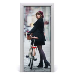Fototapeta samolepiace dvere žena na bicykli
